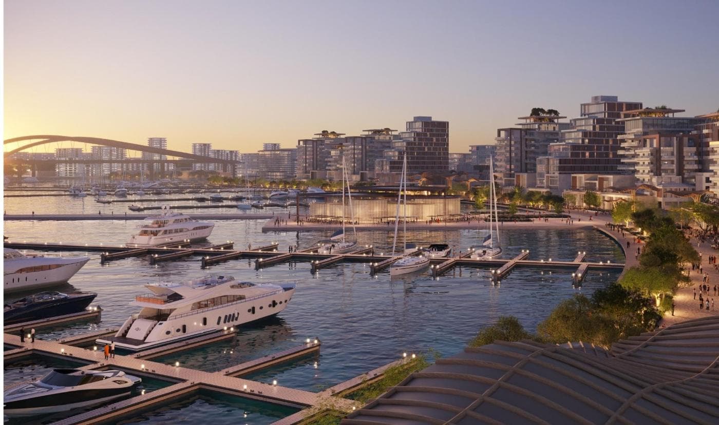 Render of the marina at sunset with yachts and waterfront buildings